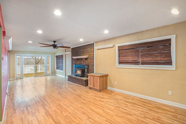 unfurnished living room with ceiling fan and light wood-type flooring