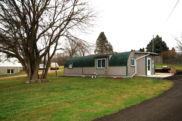 view of home's exterior featuring a lawn