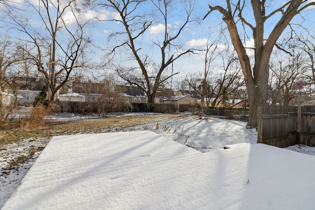 view of yard layered in snow