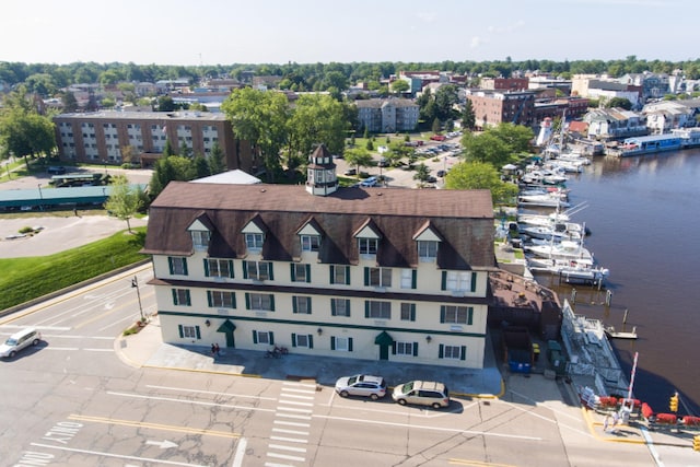 birds eye view of property with a water view