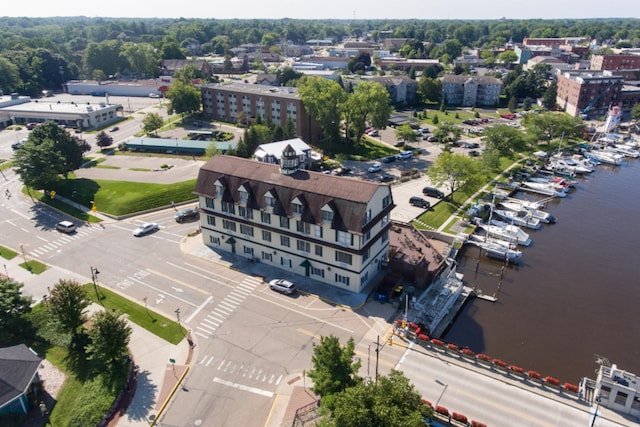 birds eye view of property with a water view