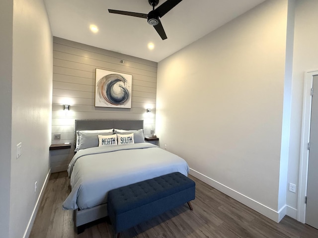 bedroom with ceiling fan and dark wood-type flooring