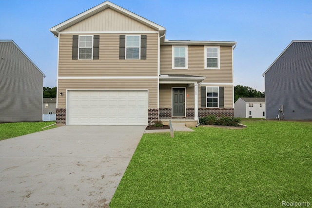 2200 Gunnison Ln, Monroe, MI 48162 - view of front of home with brick siding, driveway, an attached garage, and a front yard