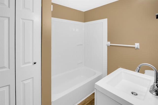 bathroom with sink and hardwood / wood-style flooring