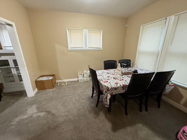 view of carpeted dining space