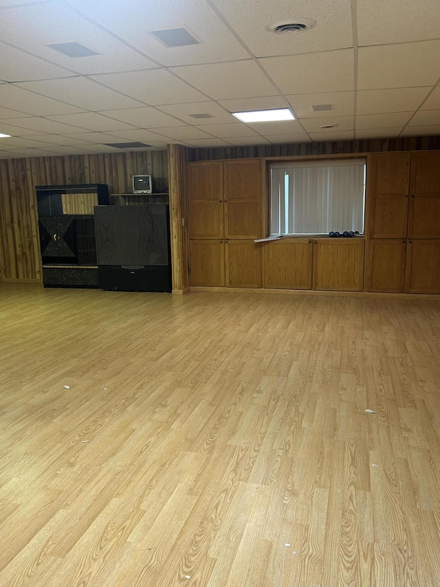 832 E Park Dr, Niles, MI 49120 - spare room with a drop ceiling, light wood finished floors, and wooden walls