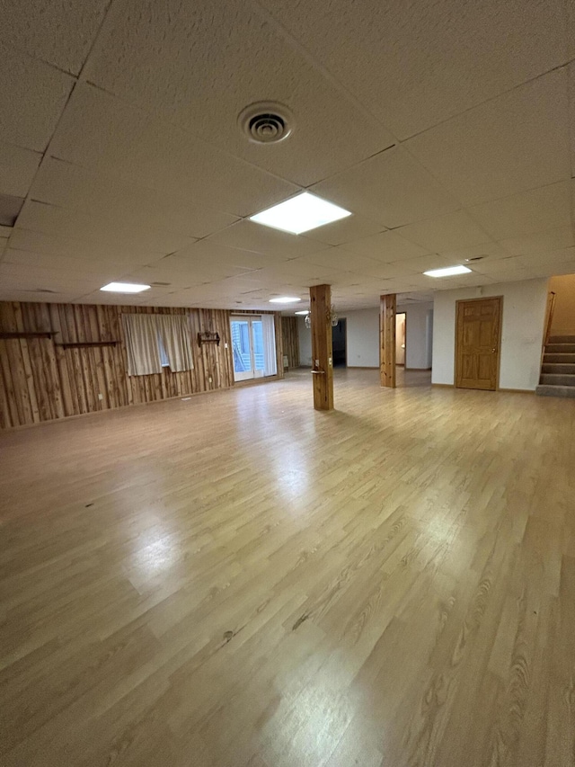 832 E Park Dr, Niles, MI 49120 - basement with light wood-style flooring, a paneled ceiling, and stairway