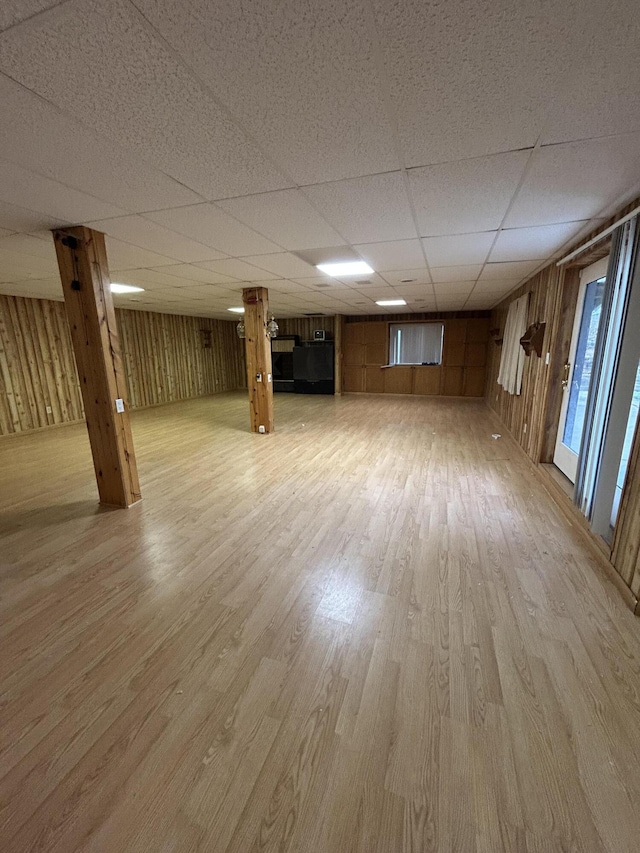 832 E Park Dr, Niles, MI 49120 - basement featuring a drop ceiling, light wood finished floors, and wood walls