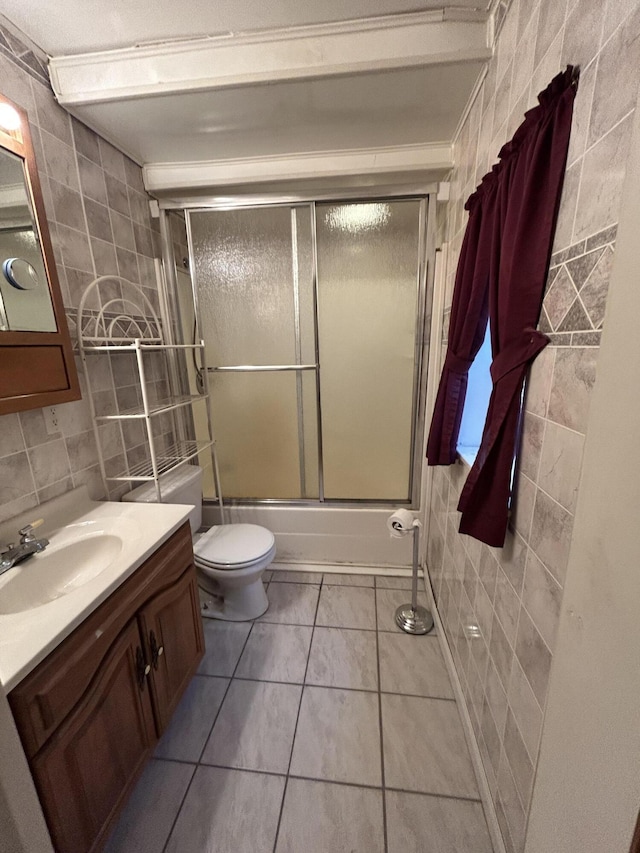 832 E Park Dr, Niles, MI 49120 - full bathroom with tile walls, vanity, enclosed tub / shower combo, and tile patterned floors