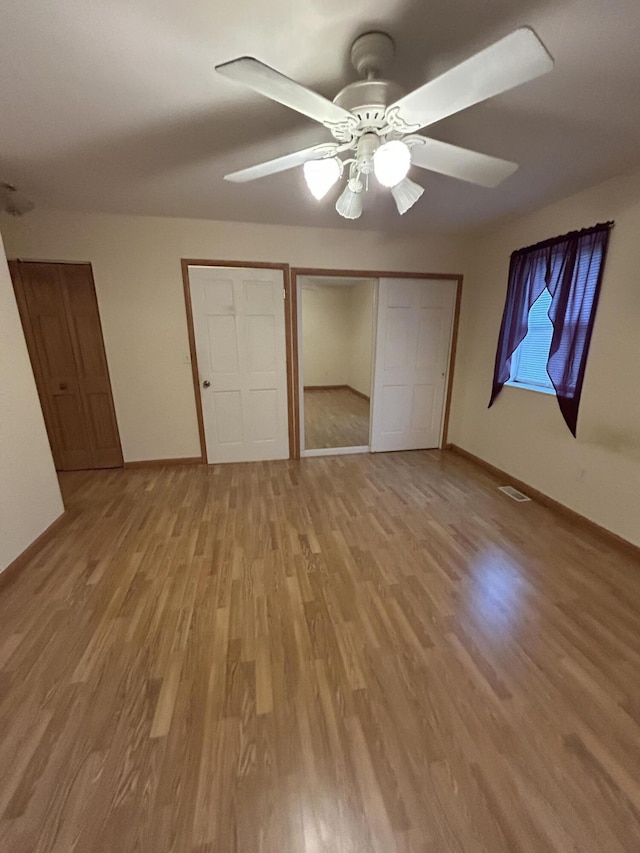 832 E Park Dr, Niles, MI 49120 - unfurnished bedroom with light wood finished floors, a closet, and ceiling fan