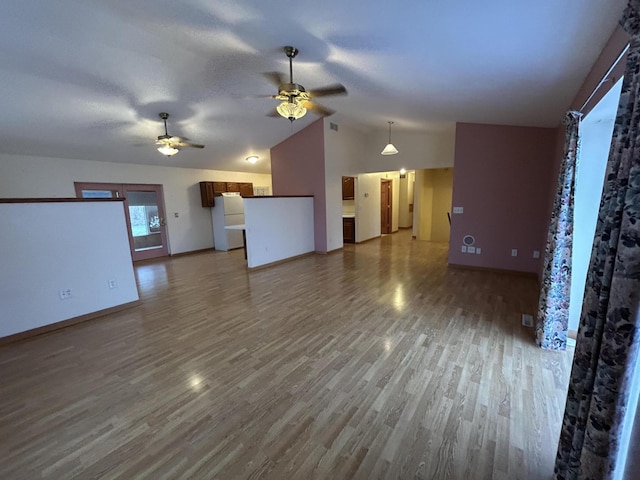 832 E Park Dr, Niles, MI 49120 - unfurnished living room featuring a ceiling fan, lofted ceiling, and wood finished floors