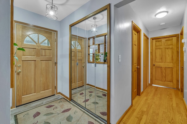 foyer with light hardwood / wood-style floors