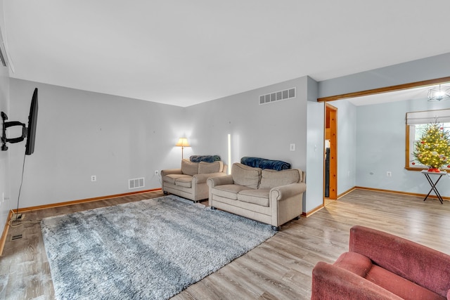 living room with light hardwood / wood-style flooring