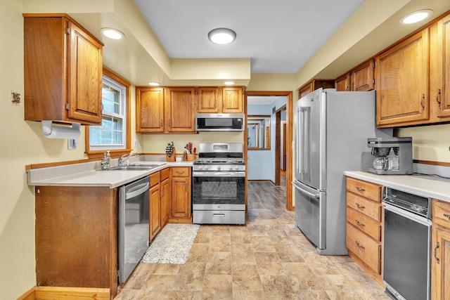 kitchen with sink and appliances with stainless steel finishes