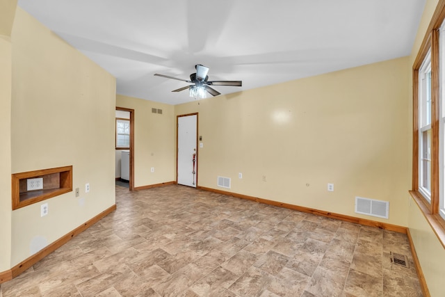 empty room featuring ceiling fan