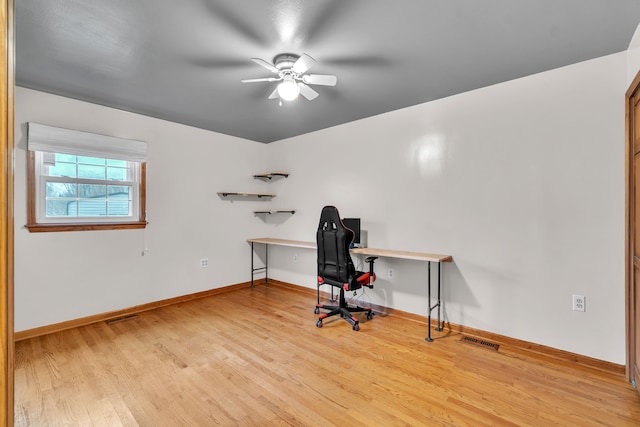 office area with light hardwood / wood-style floors and ceiling fan