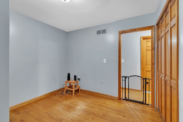 spare room featuring light hardwood / wood-style floors