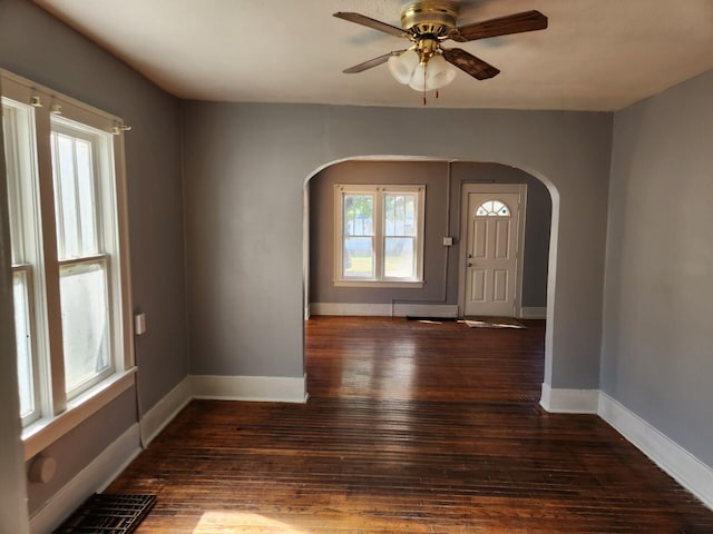 foyer entrance featuring dark hardwood / wood-style floors and ceiling fan