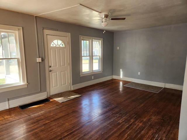 entryway with ceiling fan, dark hardwood / wood-style flooring, and a healthy amount of sunlight