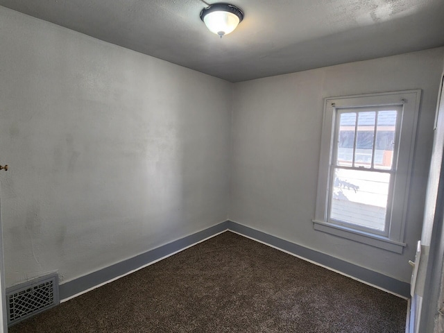 spare room featuring carpet flooring