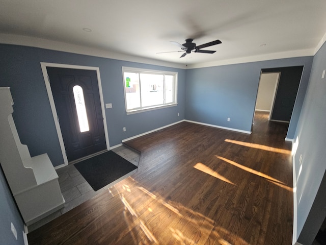 entrance foyer featuring ceiling fan and dark wood-type flooring