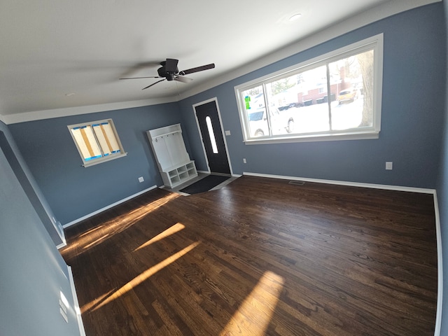 entrance foyer featuring lofted ceiling, ceiling fan, and dark wood-type flooring