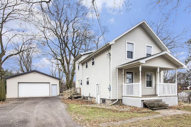 view of front facade with a porch, an outdoor structure, and a garage