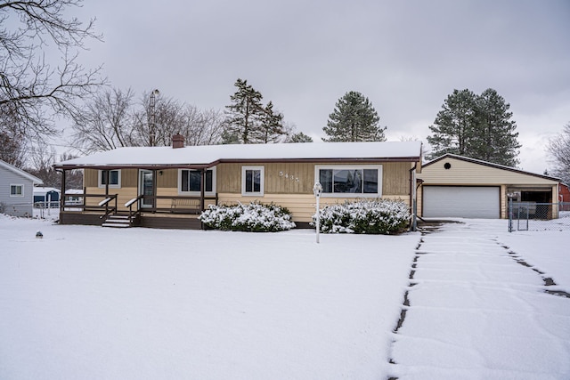 view of front of property featuring an outbuilding and a garage