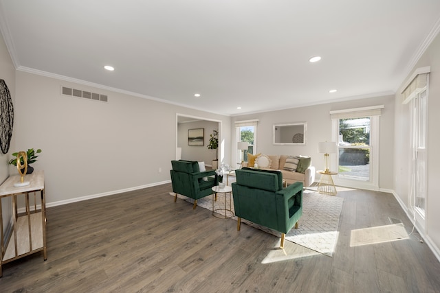 living room with dark hardwood / wood-style floors and crown molding