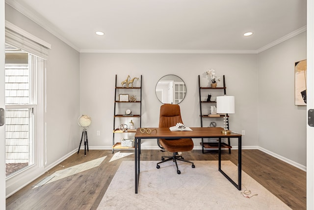 office featuring hardwood / wood-style flooring, a wealth of natural light, and crown molding