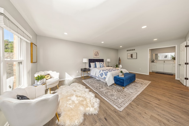 bedroom with hardwood / wood-style flooring