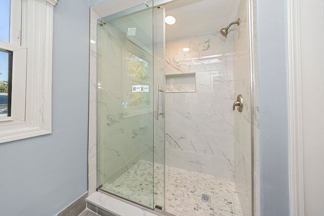 bathroom featuring an enclosed shower