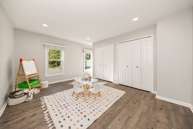 recreation room with dark hardwood / wood-style flooring