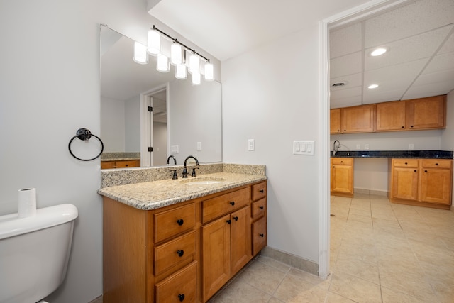 bathroom featuring toilet, vanity, and tile patterned floors