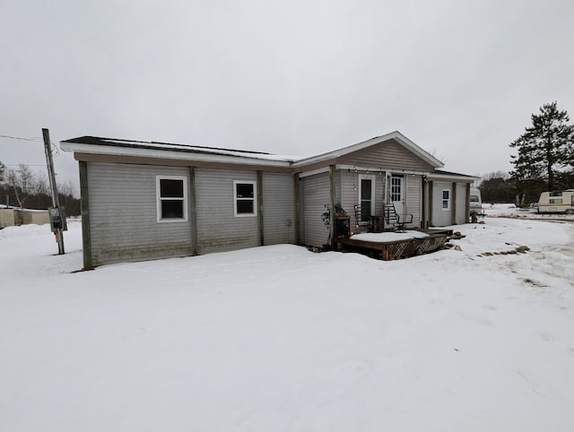 view of snow covered house