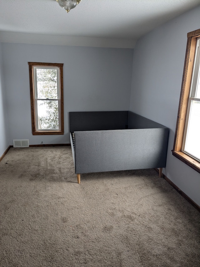 unfurnished bedroom with carpet