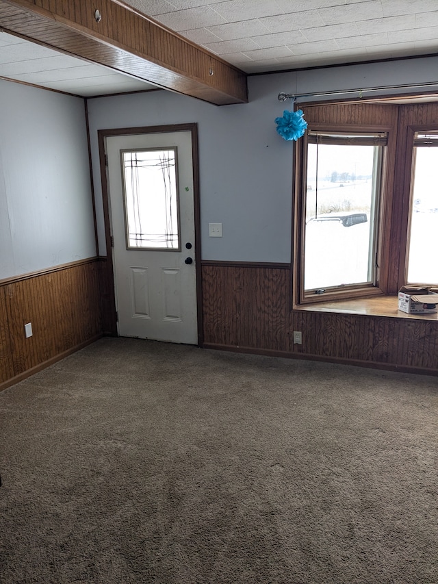 foyer featuring carpet flooring