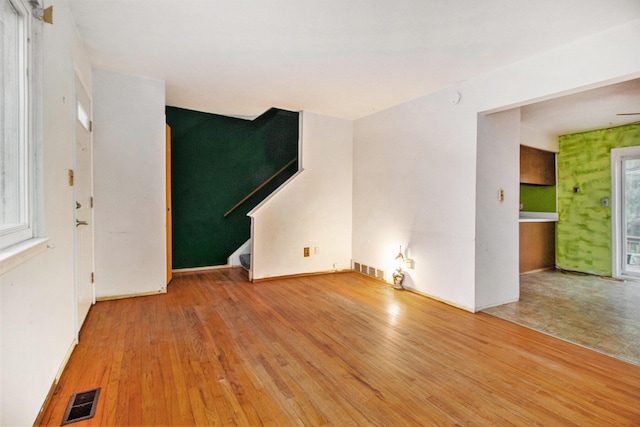 unfurnished living room with hardwood / wood-style flooring