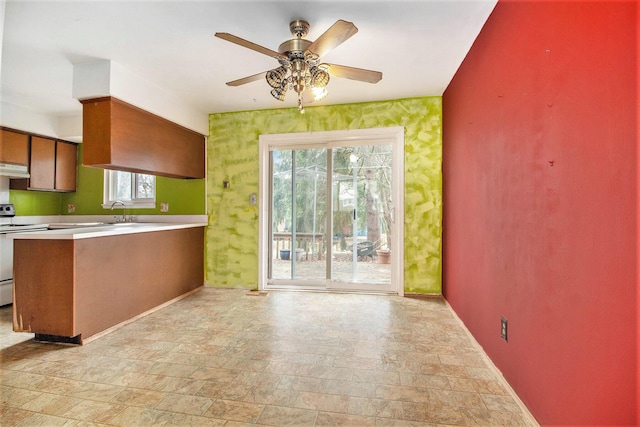 kitchen with ceiling fan and range with electric cooktop