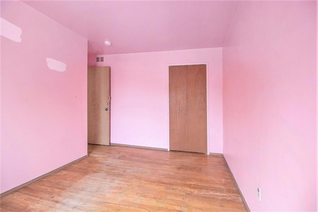 spare room with light wood-type flooring