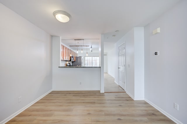 spare room with light wood-type flooring