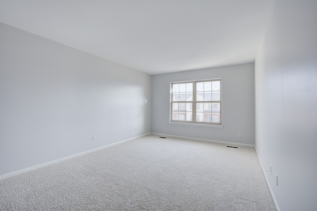 unfurnished room featuring carpet flooring