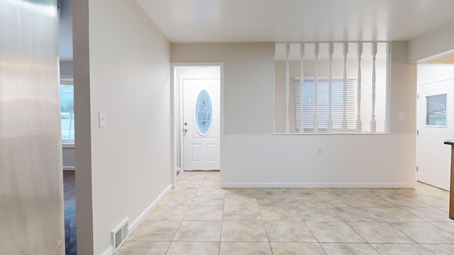 tiled entryway with plenty of natural light