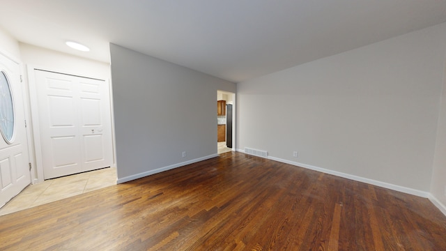 empty room featuring hardwood / wood-style flooring