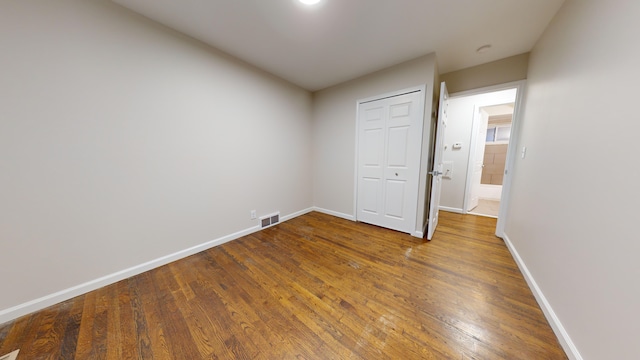 unfurnished room featuring wood-type flooring