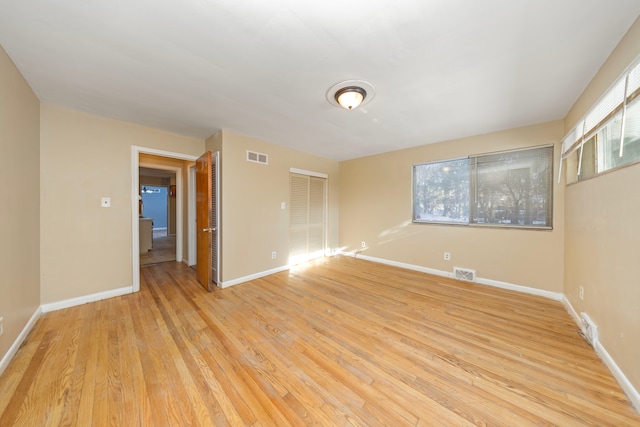 unfurnished room featuring light hardwood / wood-style floors