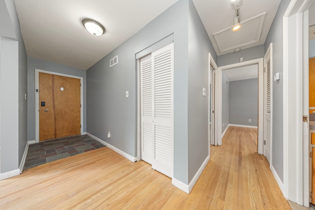 foyer with light hardwood / wood-style floors