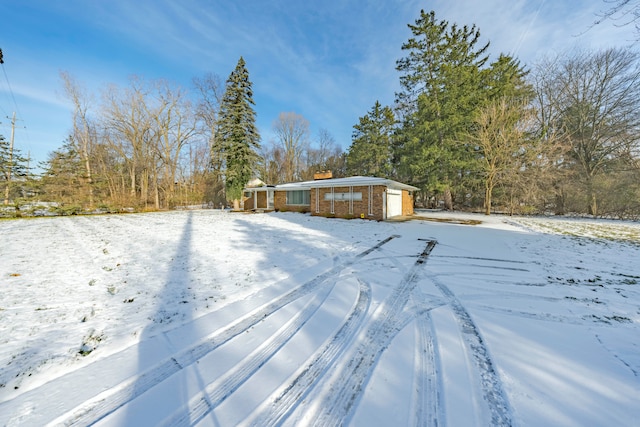 view of yard layered in snow