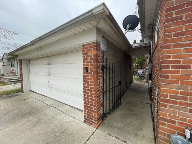 view of side of home featuring a garage