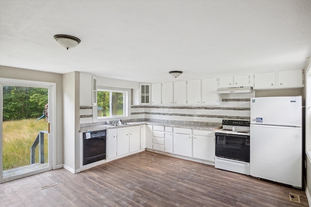 kitchen with white cabinetry, sink, dark hardwood / wood-style flooring, white appliances, and decorative backsplash